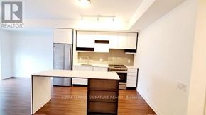 Mississauga (City Centre) condo for rent - A white room with a desk and a chair.
