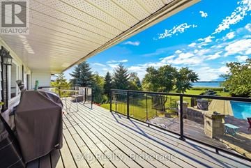 Prince Edward County (Ameliasburg Ward) apartment for rent - A deck with a pool and a hot tub.