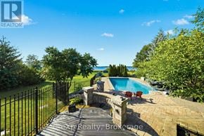 Prince Edward County (Ameliasburg Ward) apartment for rent - A backyard with a pool and a fence.