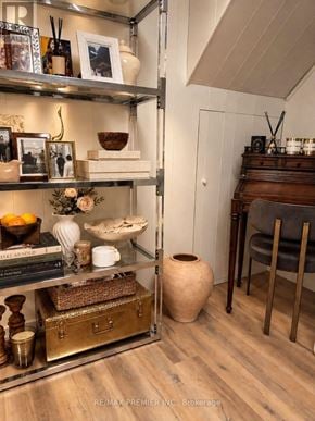 Oakville (Wo West) apartment for rent - A shelf with various decorative items is displayed in a room.