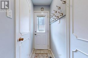 Toronto (Westminster-Branson) apartment for rent - A hallway with a white door and a white wall.