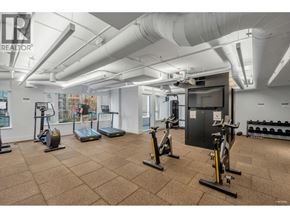 Vancouver apartment for rent - A gym with exercise equipment and a television.