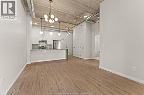 Windsor apartment for rent - A spacious office with wood flooring and a kitchenette.