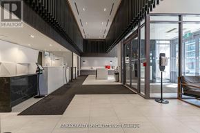 Mississauga (City Centre) condo for rent - A hallway with a black and white color scheme and a sign that says REALTOR.