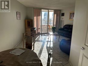 Toronto (West Humber-Clairville) condo for rent - A bedroom with a bed, a couch, and a chair in it.