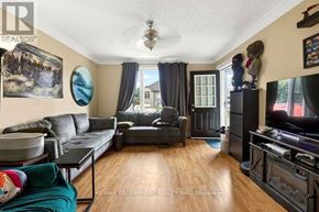 Thorold (Thorold Downtown) apartment for rent - A living room with a grey couch and a black coffee table.