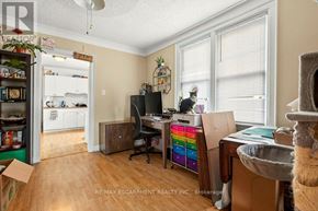 Thorold (Thorold Downtown) apartment for rent - A room with a desk, chair, and a cat tree.