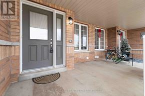 Thorold (Confederation Heights) townhouse for rent - A house entrance with a door and a window.