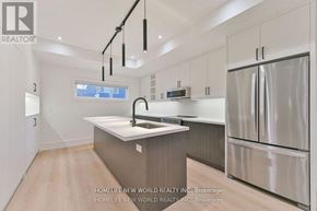 Toronto (Dufferin Grove) apartment for rent - A modern kitchen with a sink, refrigerator, and cabinets.