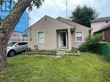 Toronto (Lansing-Westgate) apartment for rent - A small house with a car parked in front.