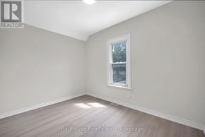 Kawartha Lakes (Lindsay) apartment for rent - A room with a window and wooden flooring.