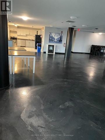 Toronto (Clairlea-Birchmount) condo for rent - A large open space with a kitchen area in the background.