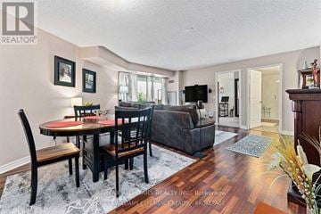 Toronto (Clairlea-Birchmount) condo for rent - A dining room with a table set for two and a couch.
