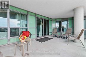 Toronto (Clairlea-Birchmount) condo for rent - A brown leather couch with a wooden coffee table in front of it.