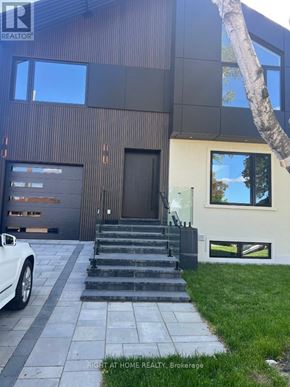 Toronto (Islington-City Centre West) apartment for rent - A modern house with a white car parked in front.