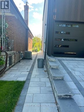 Toronto (Islington-City Centre West) apartment for rent - A stone pathway leads to a garage.