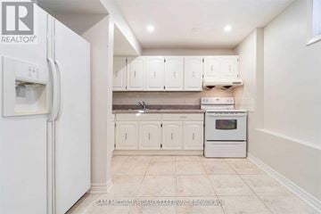Mississauga (Cooksville) apartment for rent - A kitchen with white cabinets and appliances.