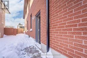 Mississauga (Cooksville) apartment for rent - A red brick wall with a black pipe running along it.