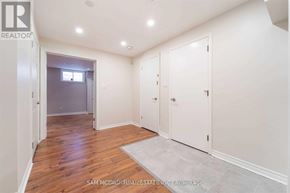 Mississauga (Cooksville) apartment for rent - A room with a white door and a grey rug on the floor.