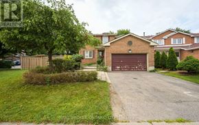 Brampton (Brampton South) apartment for rent - A residential area with a house and a garage.