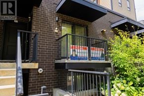 Kitchener townhouse for rent - A balcony with a metal railing and a sign that reads "REALTOR".