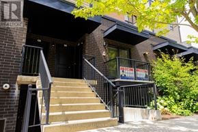 Kitchener townhouse for rent - A building with a sign that says "REALTOR" on the top left corner.