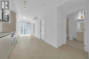 Toronto (Waterfront Communities) condo for rent - A spacious kitchen with light wood flooring and white walls.