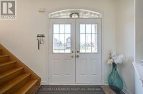 Whitchurch-Stouffville (Stouffville) apartment for rent - A white door with a glass window is flanked by two white panels.