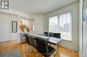 Whitchurch-Stouffville (Stouffville) apartment for rent - A well-lit room with a table and chairs.