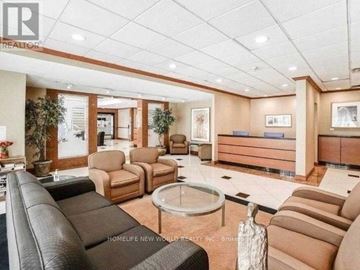 Toronto (Bay Street Corridor) condo for rent - A living room with brown leather couches and a glass coffee table.