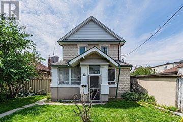 Toronto (East End-Danforth) apartment for rent - A house numbered 12 has a white door and a small front yard.