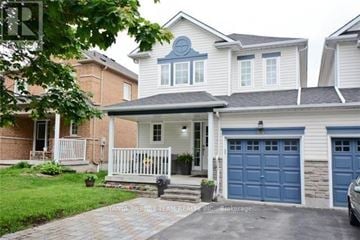 Whitby (Brooklin) townhouse for rent - A house with a blue garage door is for sale.
