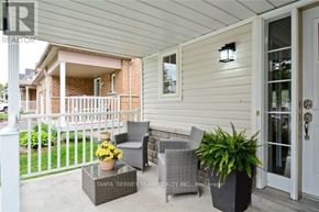 Whitby (Brooklin) townhouse for rent - A patio with a table, chairs and potted plants.