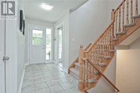 Whitby (Brooklin) townhouse for rent - A wooden staircase with a light brown finish and white steps.