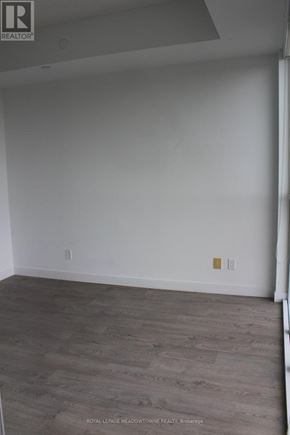 Toronto (Woodbine Corridor) condo for rent - A room with wooden flooring and white walls.