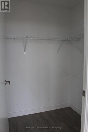 Toronto (Woodbine Corridor) condo for rent - A white closet with a wooden floor and a white door.