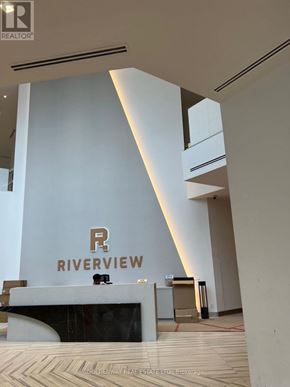 Markham (Unionville) condo for rent - A white reception desk with a gold logo on it.