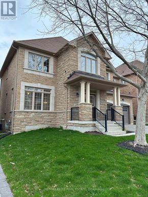 Newmarket (Stonehaven-Wyndham) apartment for rent - A large house with a stone facade and a tree in front.