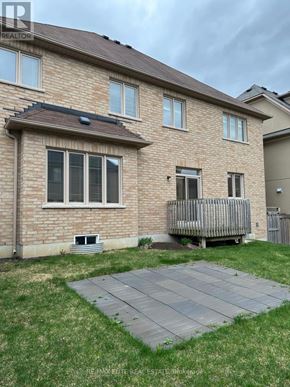 Newmarket (Stonehaven-Wyndham) apartment for rent - A brick house with a grey deck in front.