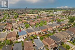Brampton (Fletcher's Meadow) apartment for rent - A bird's eye view of a residential area with houses and a church in the distance.