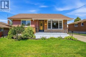 Niagara Falls (Arad/Fallsview) apartment for rent - A house with a brown roof and a porch with a white railing.