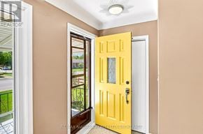 Niagara Falls (Arad/Fallsview) apartment for rent - A yellow door is open to a hallway.