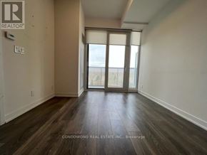 Toronto (Willowdale East) condo for rent - A room with a sliding glass door leading to a balcony.