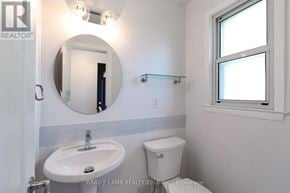 Mississauga (Mississauga Valleys) townhouse for rent - A bathroom with a sink, toilet and mirror.