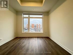 Toronto (Beechborough-Greenbrook) condo for rent - A room with a large window overlooking a cityscape.