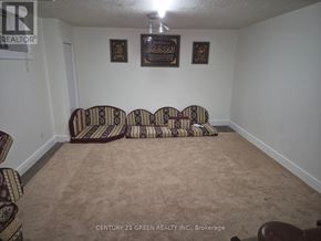 London South (South X) apartment for rent - A room with a carpeted floor and a sofa set.