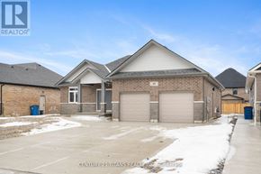 Chatham-Kent apartment for rent - A real estate company is advertising a property with a large garage.