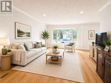 Toronto (Woburn) apartment for rent - A living room with a white couch and a wooden coffee table.