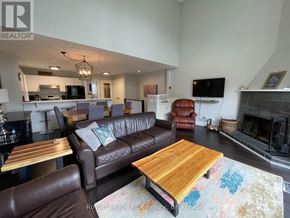 Blue Mountains townhouse for rent - A living room with a brown leather couch and a wooden coffee table.