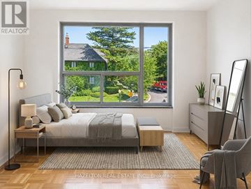 Toronto (Rosedale-Moore Park) condo for rent - A bedroom with a large bed and a view of a street outside the window.